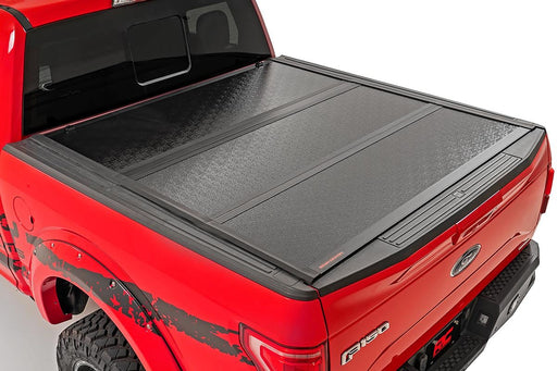 Rough Country 47220550A Low Profile Tri Fold Aluminum Tonneau Cover for 2015-2020 Ford F-150 (5' 7" Bed) - Recon Recovery