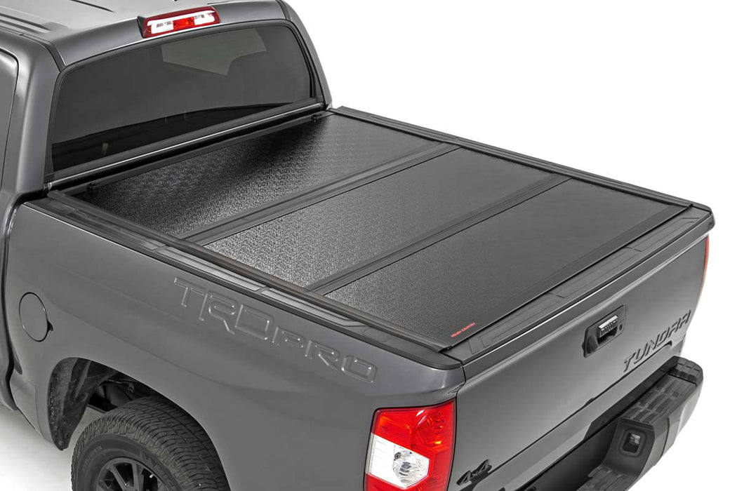 Rough Country 47414551 Low Profile Tri Fold Aluminum Tonneau Cover for 2007-2021 Toyota Tundra (5' 7" Bed) - Recon Recovery